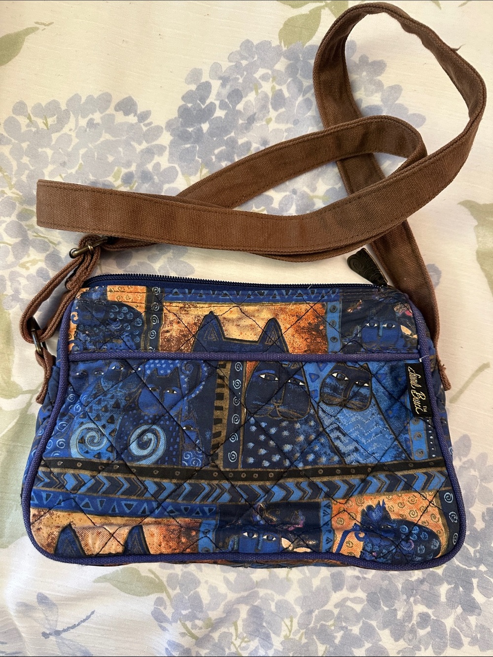Lesportsac Blue Quilted Crossbody Bag with Brown Strap and Orange Accents